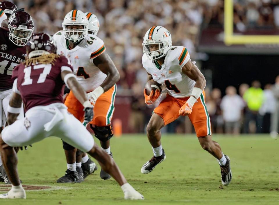 Miami Hurricanes running back Jaylan Knighton (4) carries the ball during game against Texas A&M Aggies at Kyle Field, Bryan College Station, Texas on Saturday, September 17, 2022.