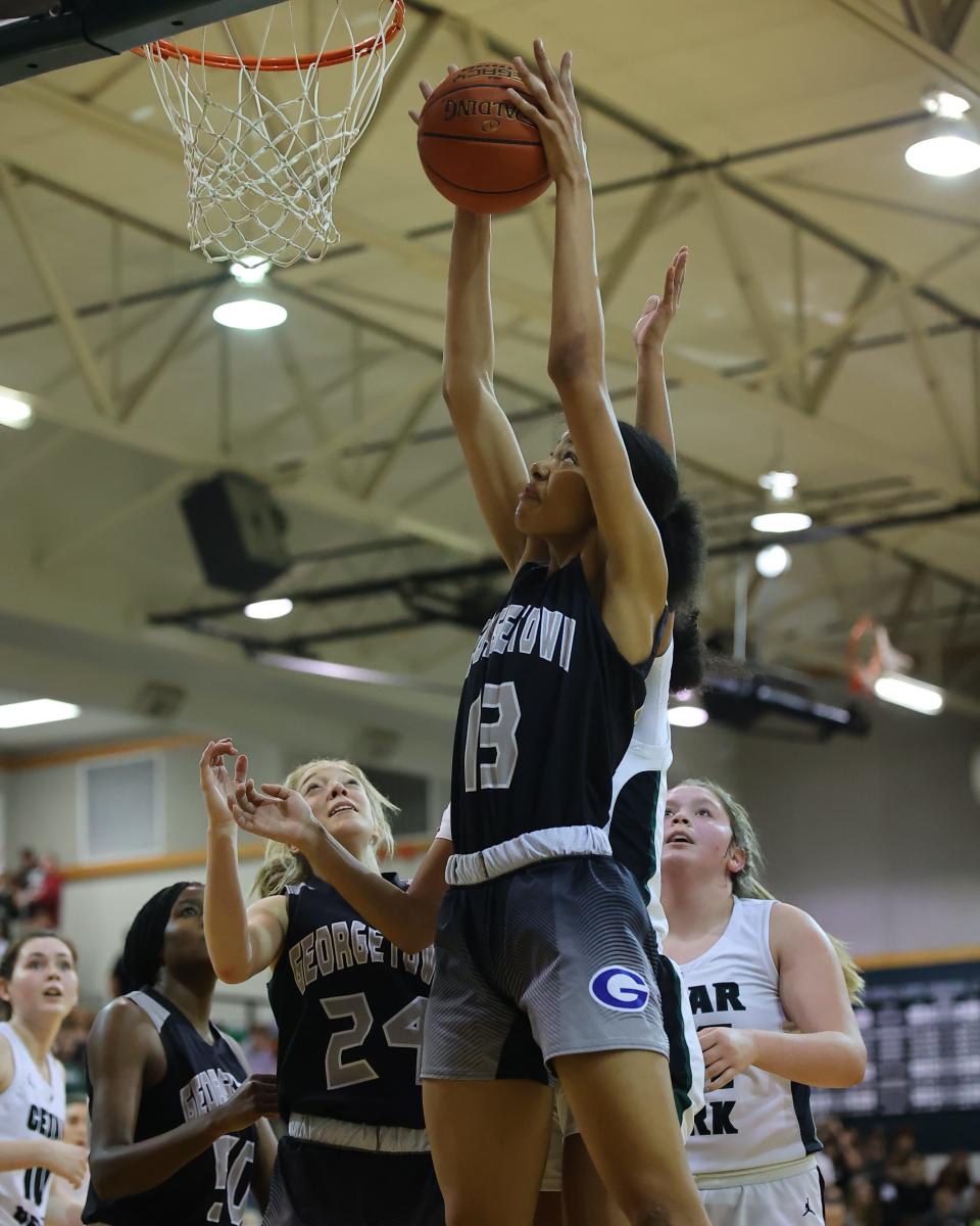 Niah Williams soars for the Georgetown rebound against Cedar Park in the district finale Tuesday at Cedar Park High School. Cedar Park's offense came alive in the second half en route to a 50-24 victory.