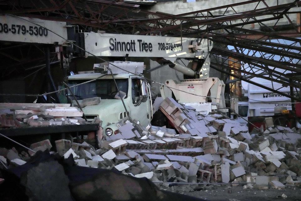 Damage is seen to the Sinnott Tree Service building in McCook, Ill., Wednesday, July 12, 2023. A tornado touched down Wednesday evening near Chicago’s O’Hare International Airport, prompting passengers to take shelter and disrupting hundreds of flights. There were no immediate reports of injuries. . (AP Photo/Nam Y. Huh)