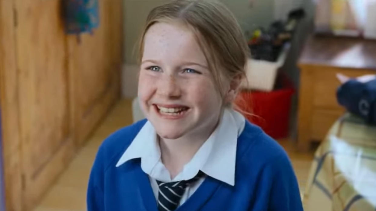 Lulu Popplewell as Daisy, daughter of Emma Thompson's character, in the 2003 Christmas classic 'Love Actually'. (Credit: Universal)