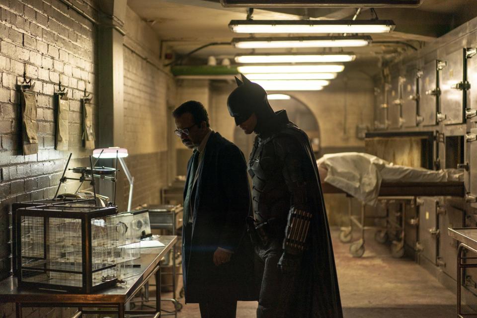 Lt. James Gordon and Robert Pattinson's Batman looking at evidence in The Batman 2022