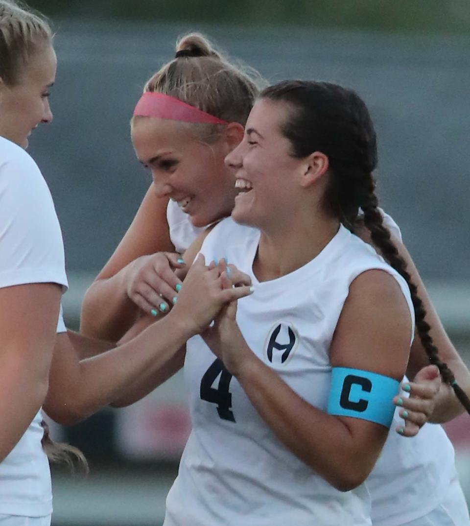 Simone Thiel of Hoban is congratulated by teammates for scoring a goal against Manchester during the second half of their game at Manchester High School in New Franklin on Monday. 