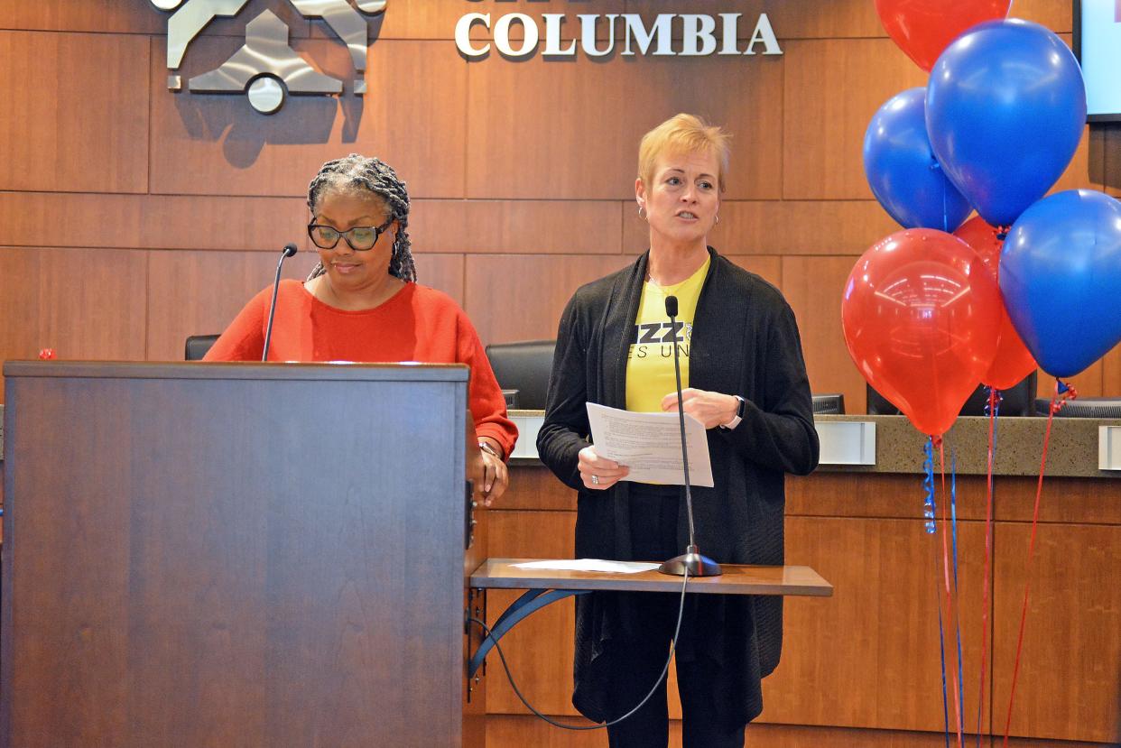 Eryca Neville, Heart of Missouri United Way board chair, and Mitzi Clayton, chair of the Community Impact Committee, on Thursday reveal service organizations receiving annual grants from United Way between 2023-2025 during a ceremony at Columbia City Hall.