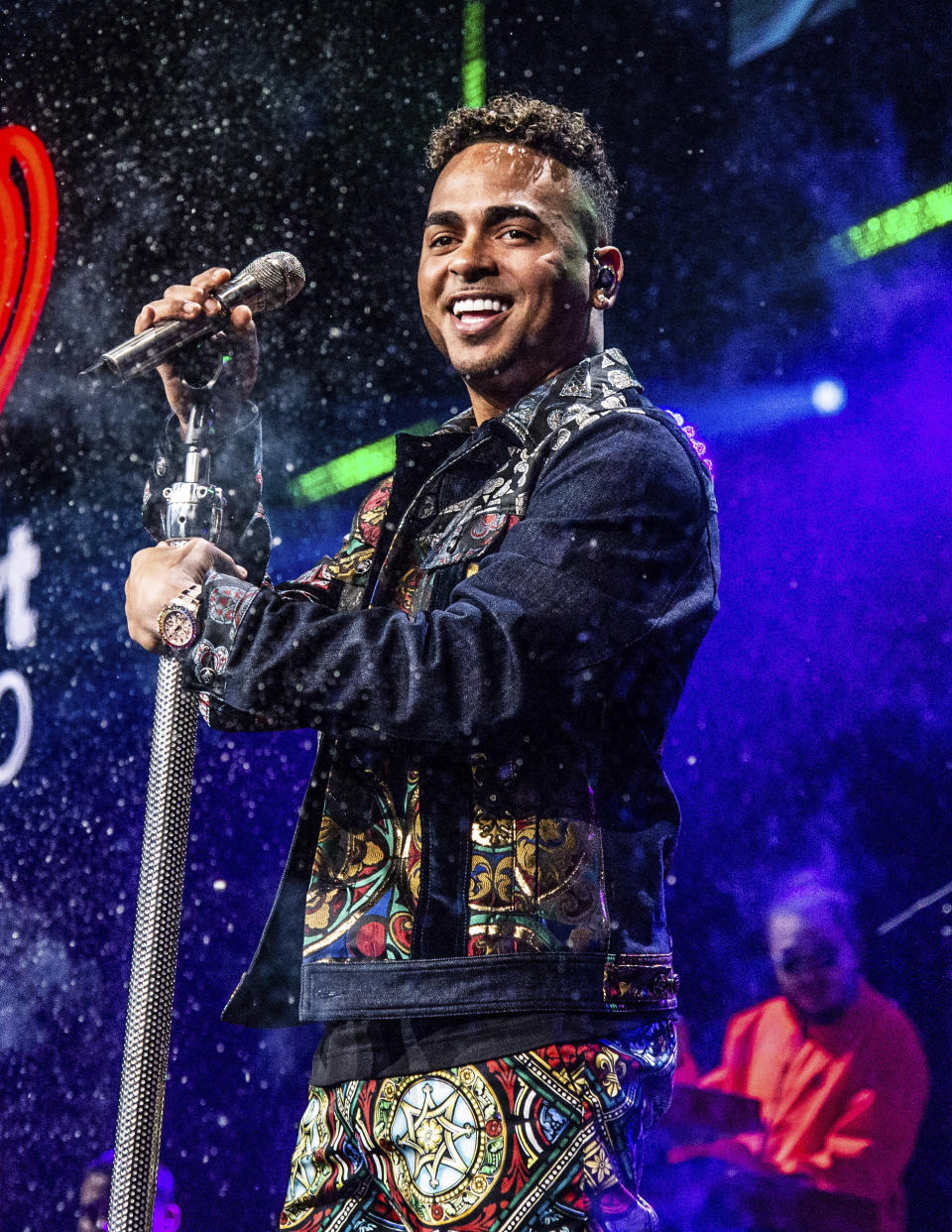 FILE - Ozuna performs at Y100's Jingle Ball in Sunrise, Fla. on Dec. 22, 2019. Ozuna is nominated for eight Latin Grammy Awards. (Photo by Amy Harris/Invision/AP, File)