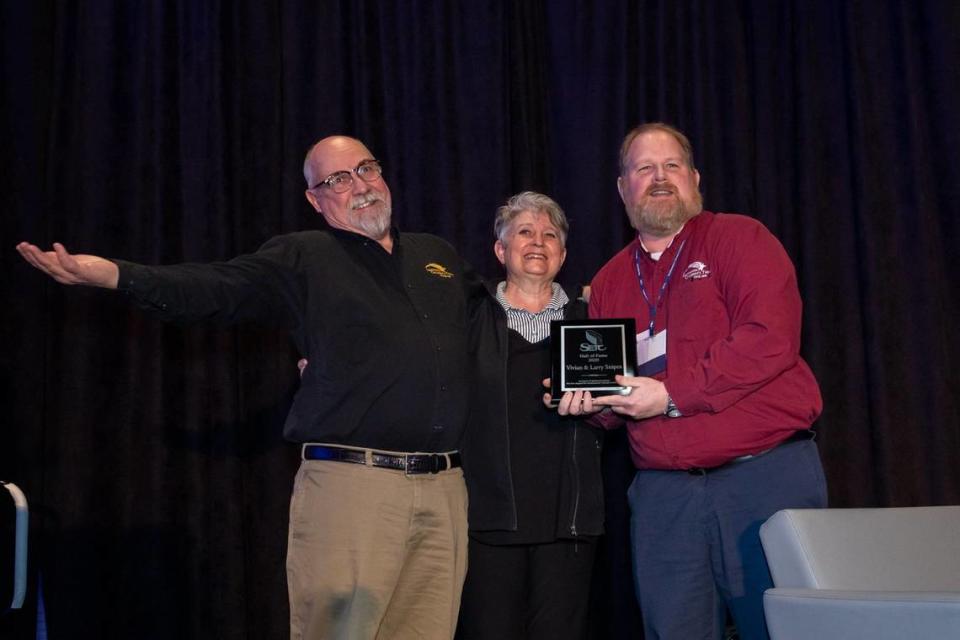 Larry and Vivian Snipes accept the 2020 SETC Hall of Fame award presented by Jeremy Kisling, right, at the SETC Business Meeting, Feb. 29, 2020 in Louisville. During the 2021-22 season, LCT plans to honor the Snipes with a weekend of events in August.