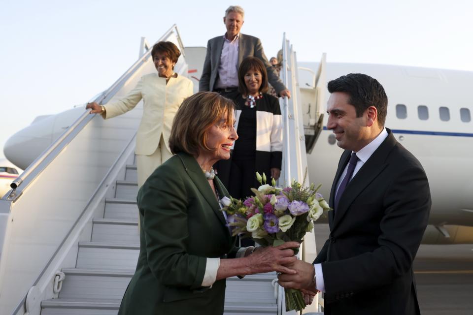 CORRECTS CREDIT - In this handout photo released by Armenian National Assembly via Photolure photo agency, Head of Armenian National Assembly Alen Simonyan, right, welcomes U.S. House of Representatives Nancy Pelosi upon her arrival at the International Airport outside of Yerevan, Armenia, Saturday, Sept. 17, 2022. A US Congressional delegation headed by Speaker of the House Nancy Pelosi arrived Saturday in Armenian, where a cease-fire has held for three days after an outburst of fighting with neighboring Azerbaijan that killed more than 200 troops from both sides. (Armenian National Assembly via Photolure photo agency via AP)