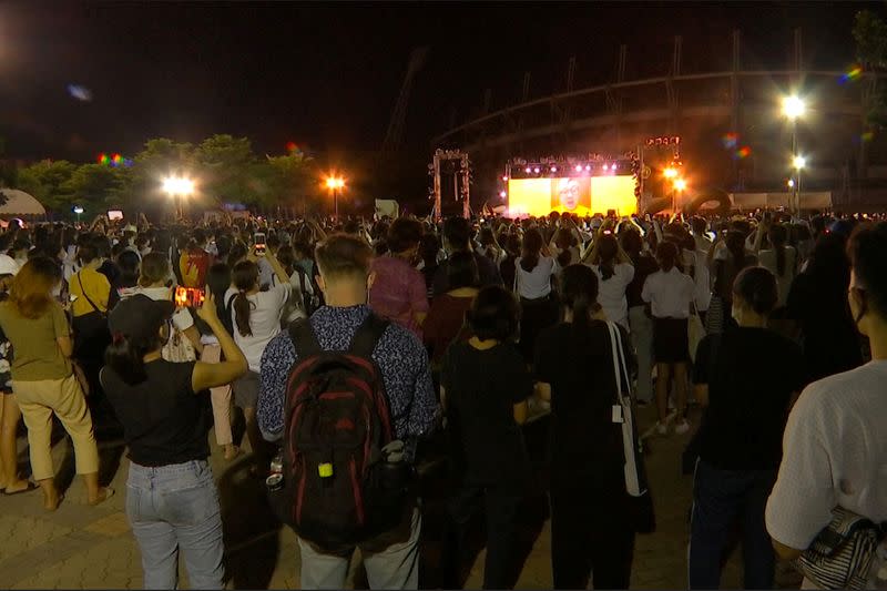 A still image from a video shows image of a former diplomat Pavin Chachavalpongpun projected at a demonstration in Bangkok