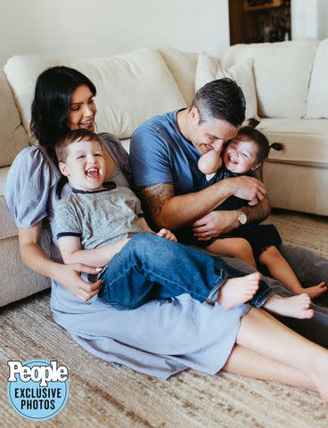 <p>Laura Waugh Photography</p> Courtney Robertson, her husband Humberto Preciado, and their children Joaquin and Paloma