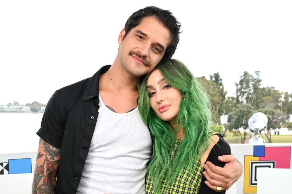 <p>Michael Kovac/Getty </p> Tyler Posey and Phem