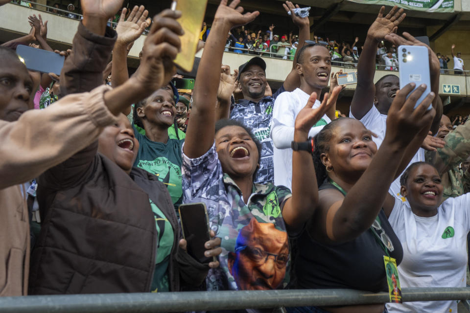 Supporters cheer former South African President Jacob Zuma as he arrives at Orlando stadium in the township of Soweto, Johannesburg, South Africa, for the launch of his newly formed uMkhonto weSizwe (MK) party's manifesto Saturday, May 18, 2024. Zuma, who has turned his back on the African National Congress (ANC) he once led, will face South African President Cyril Ramaphosa, who replaced him as leader of the ANC in the general elections later in May. (AP Photo/Jerome Delay)