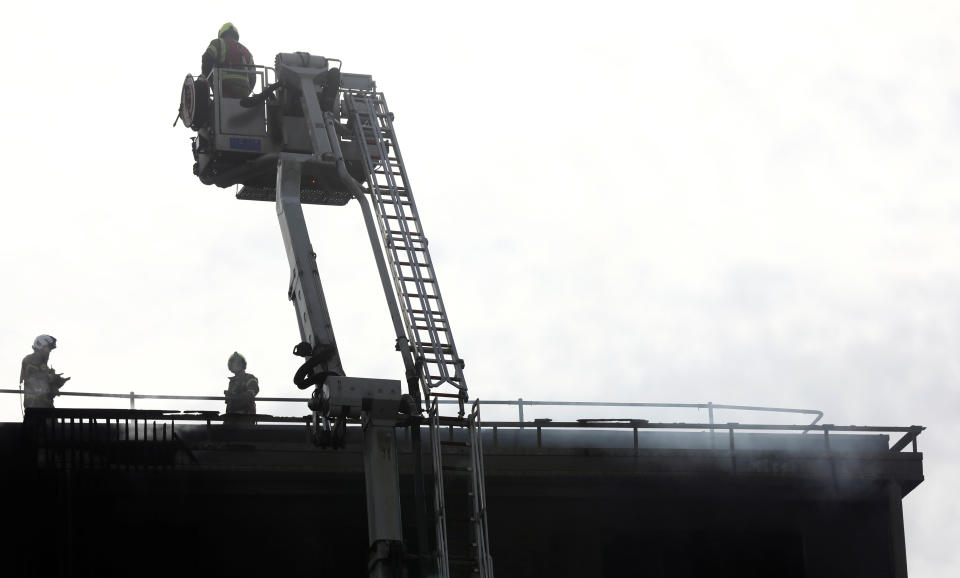 Firefighters attend to a building after a fire broke out in Barking, London, Britain, June 9, 2019. REUTERS/Simon Dawson