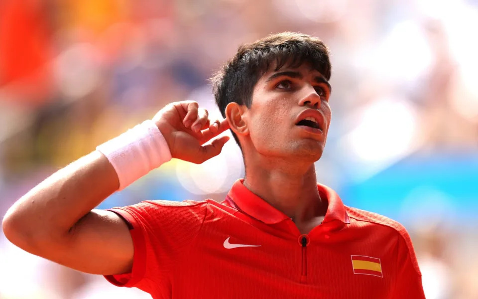 Alcaraz celebrates winning a point against Djokovic