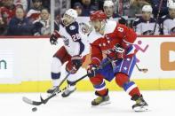 Jan 12, 2019; Washington, DC, USA; Washington Capitals left wing Alex Ovechkin (8) skates with the puck as Columbus Blue Jackets right wing Oliver Bjorkstrand (28) chases in the first period at Capital One Arena. Mandatory Credit: Geoff Burke-USA TODAY Sports