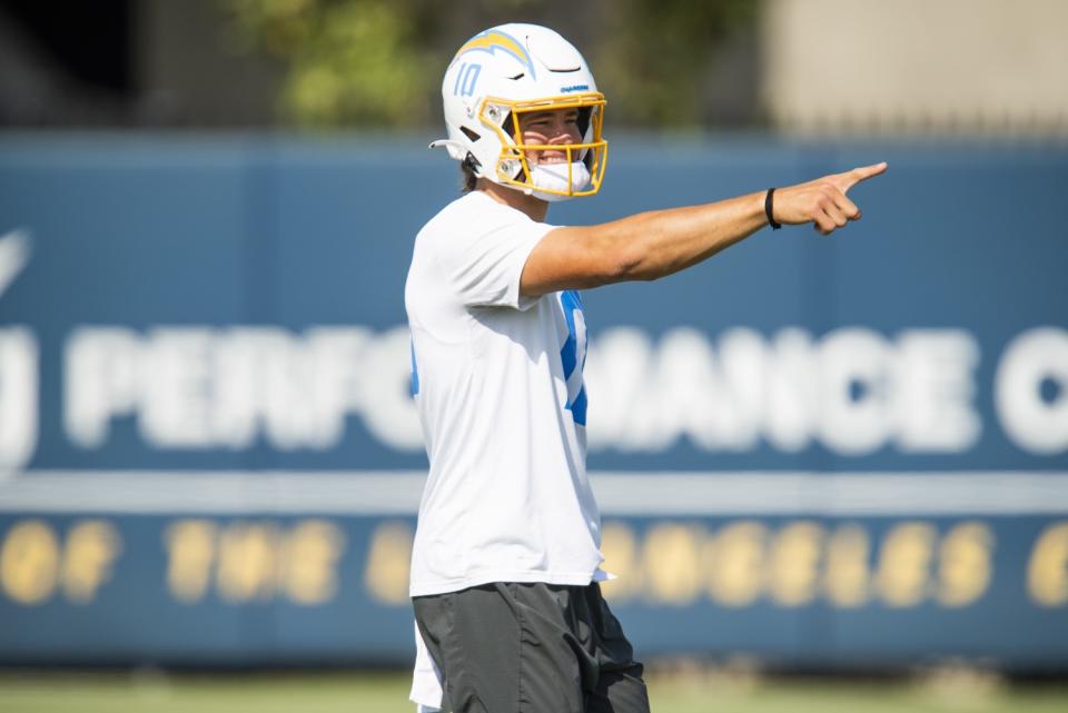 Chargers quarterback Justin Herbert gestures during minicamp in Costa Mesa.