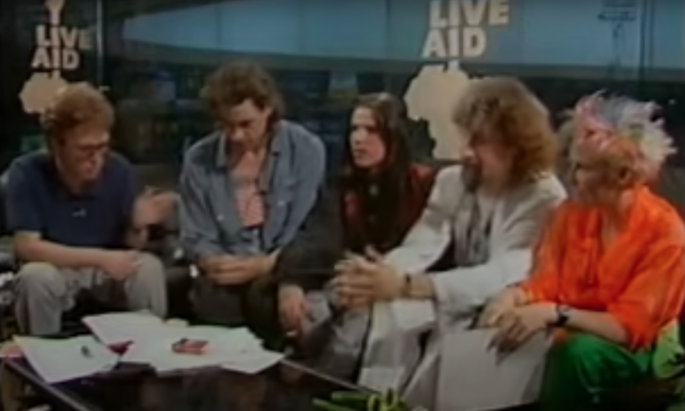 Bob Geldof (second from left) during the broadcast of Live Aid. (YouTube/BBC)