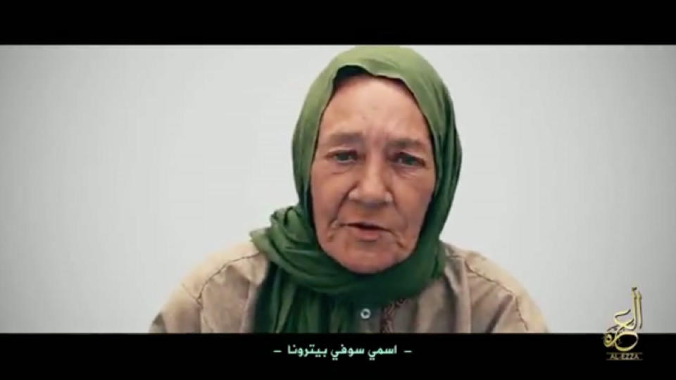 FILE - Undated file frame grab from video, posted online by militant group Nusrat al-Islam wal Muslimeen, that shows hostage Sophie Petronin in an unknown location, with a caption reading in Arabic 'My name is Sophie Petronin.' Islamic extremists have freed French aid worker Petronin, who was kidnapped back in 2016, and a prominent Malian politician Soumaila Cisse after holding him hostage for more than six months an official said Tuesday Oct. 6, 2020. (Militant Video via AP)