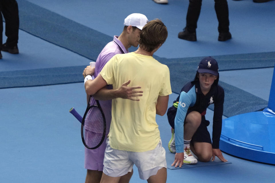 Hubert Hurkacz of Poland, left, congratulates Sebastian Korda of the U.S. following their fourth round match at the Australian Open tennis championship in Melbourne, Australia, Sunday, Jan. 22, 2023. (AP Photo/Mark Baker)