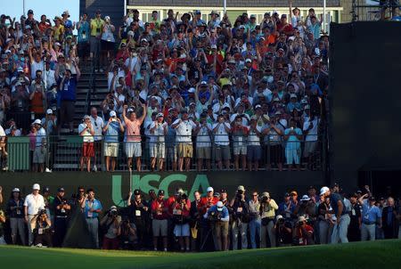 Jun 19, 2016; Oakmont, PA, USA; Dustin Johnson pumps his fist after making a putt on the 18th green during the final round of the U.S. Open golf tournament at Oakmont Country Club. Mandatory Credit: Kyle Terada-USA TODAY Sports