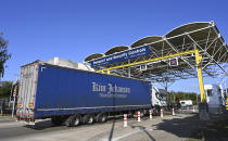 A truck on its way to France waits to be checked by employees of Eurotunnel during a day of test in case of no deal Brexit at the entrance of the Channel tunnel in Folkestone, Tuesday, Sept. 17, 2019. British Prime Minister Boris Johnson has said after a meeting with European Commission President Jean-Claude Juncker that "there is a good chance" of a Brexit deal with the European Union. (Denis Charlet, Pool via AP)