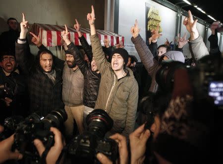 Pro-Islamist demonstrators shout slogans during a demonstration in Istanbul January 14, 2015. REUTERS/Osman Orsal