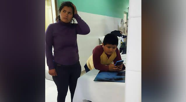 The boy waits nervously with his mother before doctors removed the whistle surgically. Source: CEN