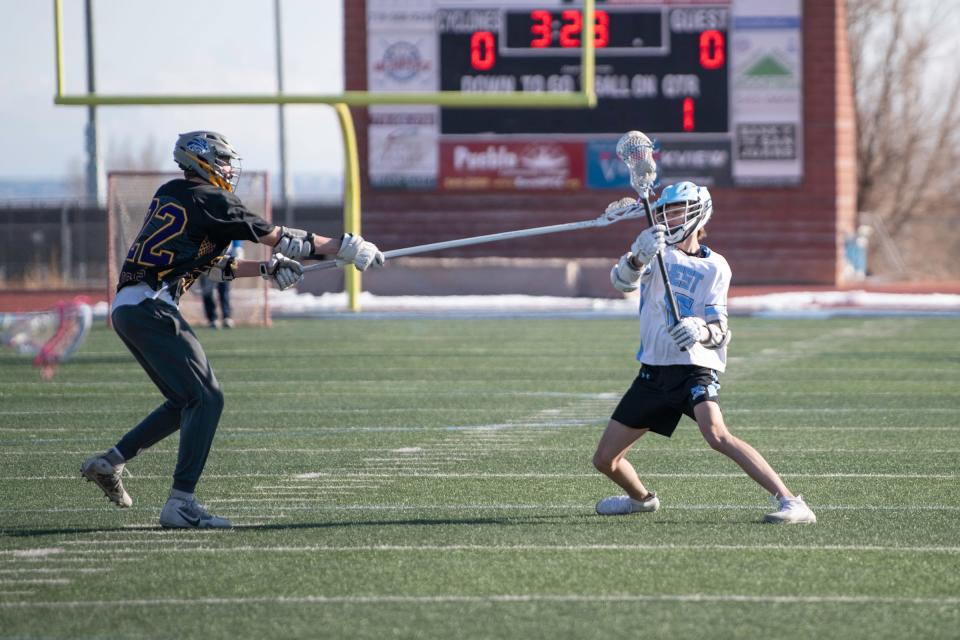 Pueblo West's Brayden Wison, right, works past a Littleton defender during a matchup on March 17.