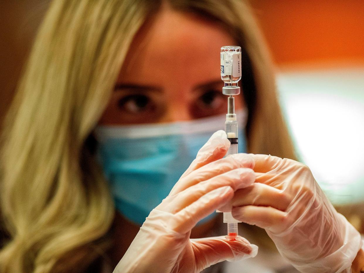 Pharmacist Madeline Acquilano fills a syringe with the Johnson & Johnson Covid-19 Vaccine before inoculating members of the public at Hartford Hospital in Hartford, Connecticut, on March 3, 2021. - Some 7,400 vials of the Johnson & Johnson Covid-19 single shot vaccine were delivered and an initial offering of the vaccine was given to ten members of the public. (Photo by Joseph Prezioso / AFP) (Photo by JOSEPH PREZIOSO/AFP via Getty Images)