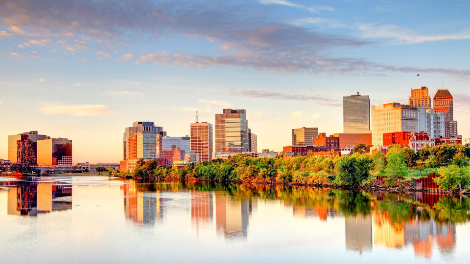 Downtown Newark skyline refection on the banks of the Passaic River.