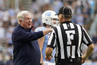 North Carolina coach Mack Brown speaks with an official during the second half of the team's NCAA college football game against Florida State in Chapel Hill, N.C., Saturday, Oct. 9, 2021. (AP Photo/Gerry Broome)