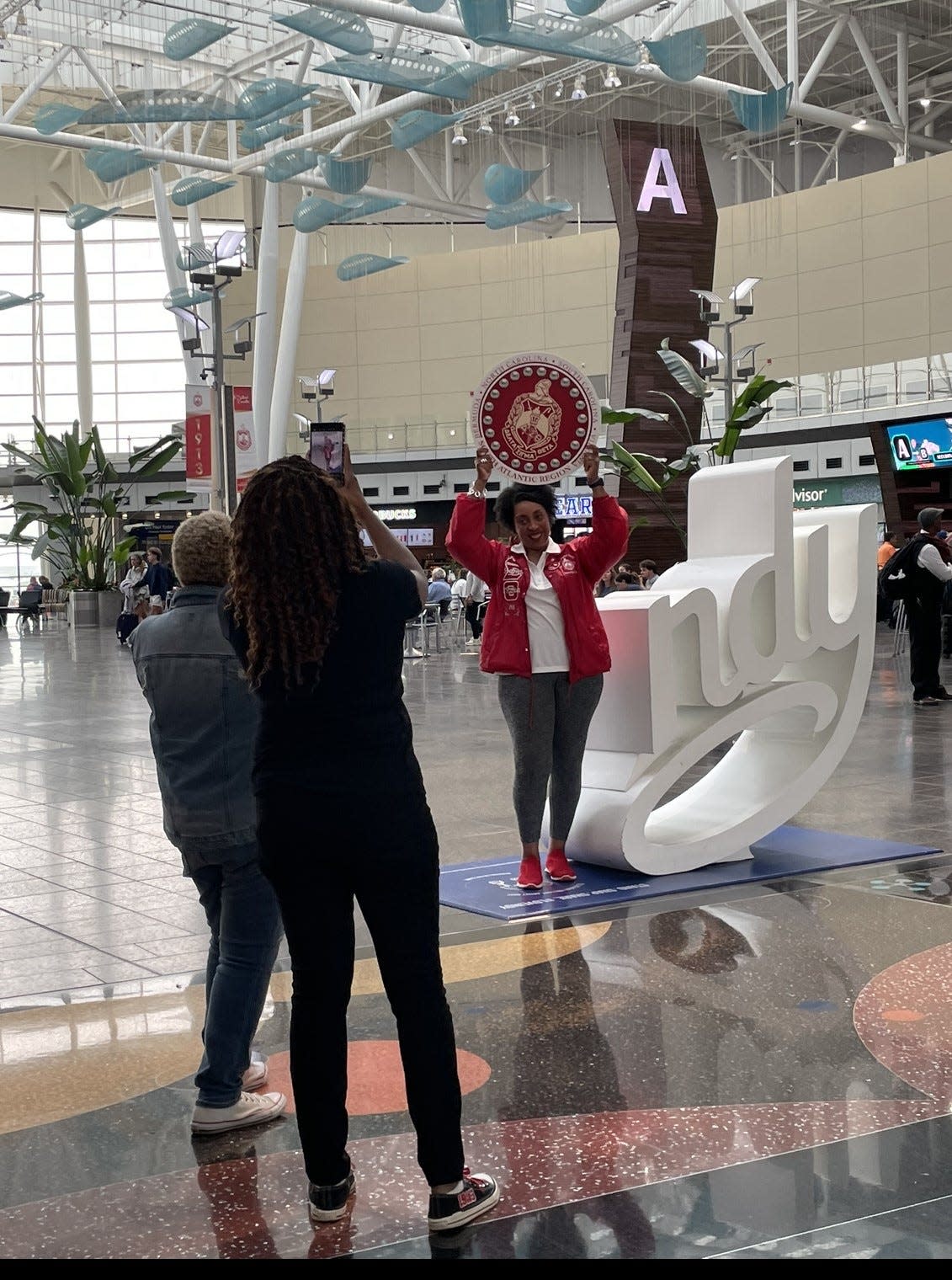 Members of Delta Sigma Theta Sorority Inc.  arrive at Indianapolis International Airport July 17, 2023, for the organization's 56th National Convention, taking place July 18-23 at the Indiana Convention Center.