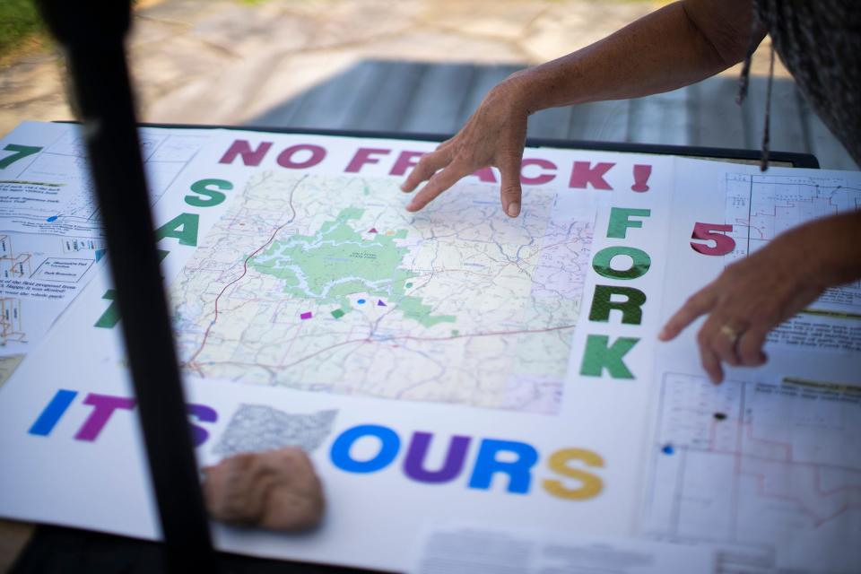 Terri Sabo points to proposed fracking sites on a map of Salt Fork State Park. Applications have come in to frack beneath Salt Fork State Park in Guernsey County and Wolf Run State Park in Noble County.