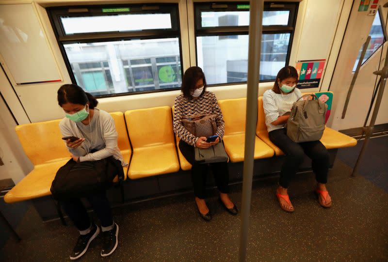 Passengers sit in the train as they follow social distancing suggestion due to coronavirus disease (COVID-19) outbreak,in Bangkok