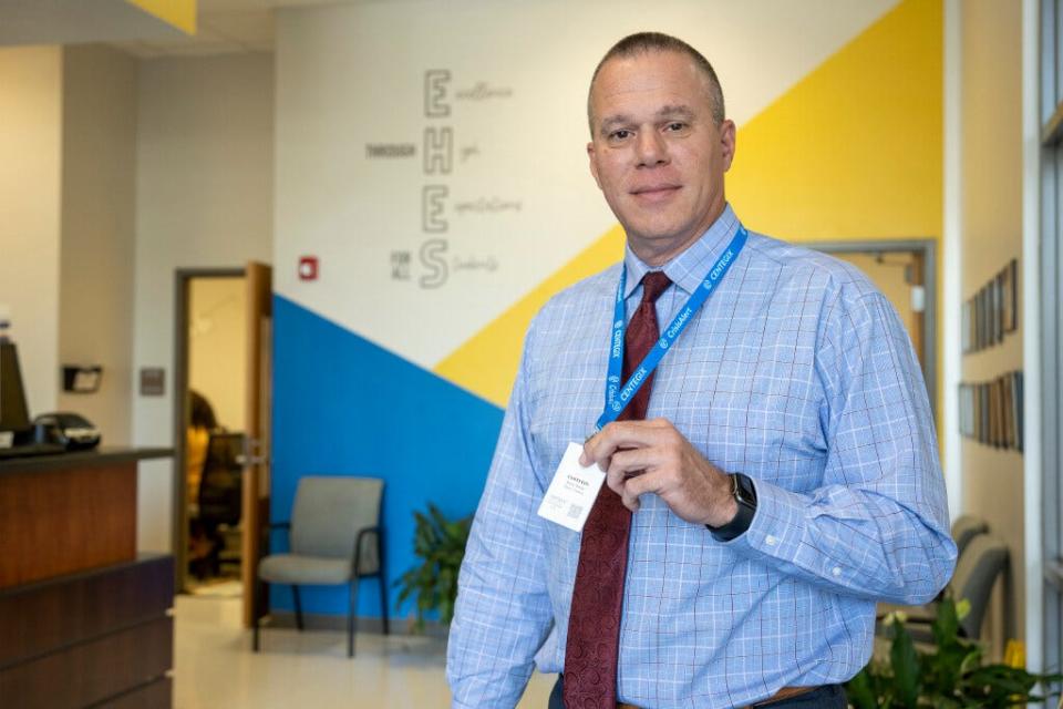 Joseph Mabry, Supervisor of Safety for Lake County Schools, shows off the new Centegix alert badge at the Eustis Heights Elementary School.