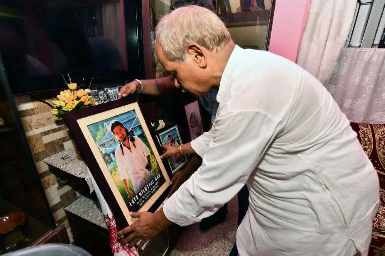 Gopal Chandra Das, father of lynching victim Nilotpal Das, with a picture of his son at his residence in Guwahati, the capital city of India's northeastern state of Assam, pictured on July 9, 2018