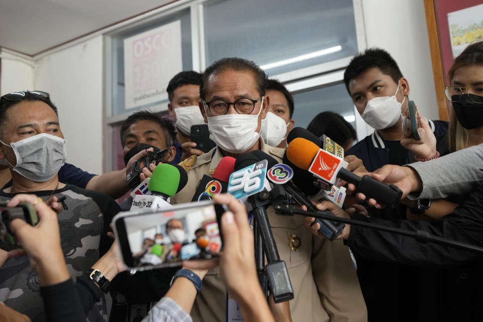 Chief executive of Uthai Sawan Sub-district Administrative Organization Danaichok Boonsom, talks to reporters at a police station in Uthai Sawan, north eastern Thailand, Sunday, Oct. 9, 2022. Thai police are investigating a report that a CNN crew inappropriately entered the daycare center where more than 20 preschoolers were slain as they were reporting on the attack, authorities said Sunday. (AP Photo/Sakchai Lalit)