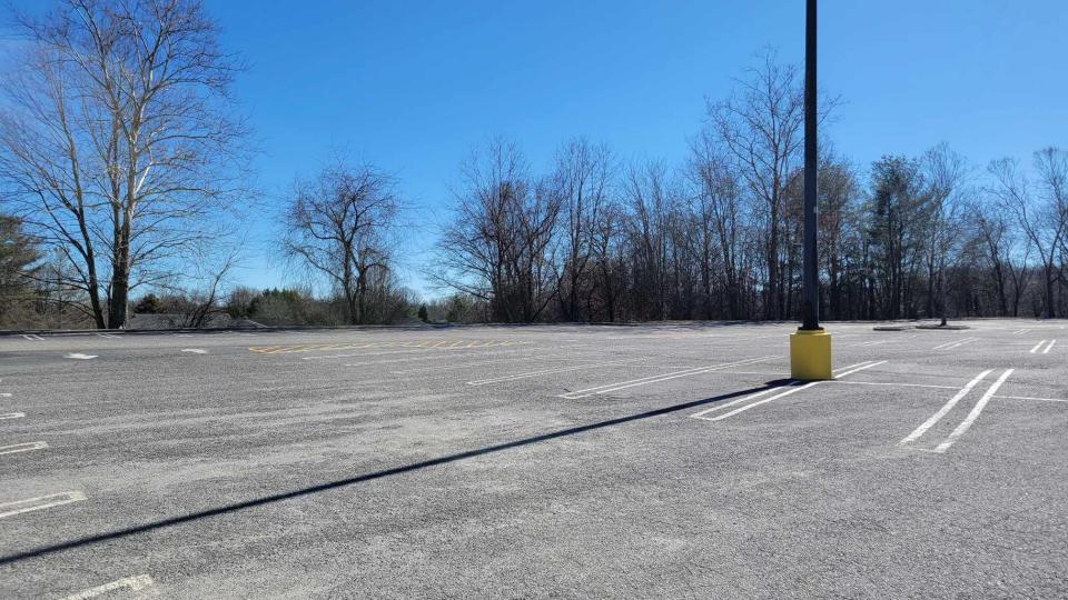 This is the area behind the Blue Ridge Mall where a developer is seeking to build a four-story extended-stay hotel. Just beyond the parking lot are residents' houses.