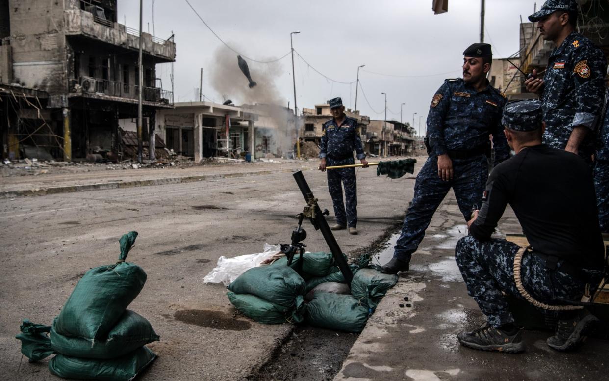 The driver claimed to lead a group associated with Isil, which these Iraqi police are battling - Getty Images Europe