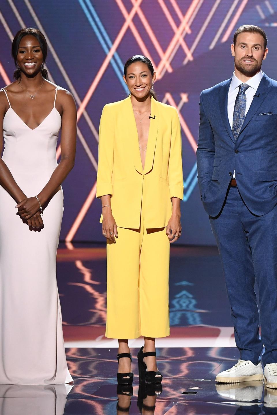 Christen Press went bold in a yellow suit.