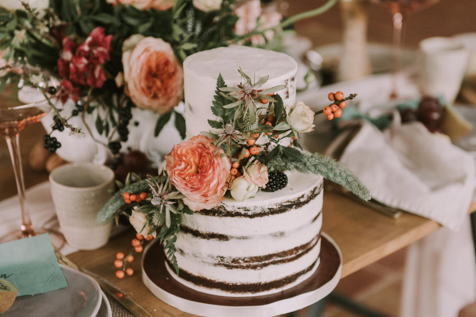 Wedding cake with little icing and floral accents