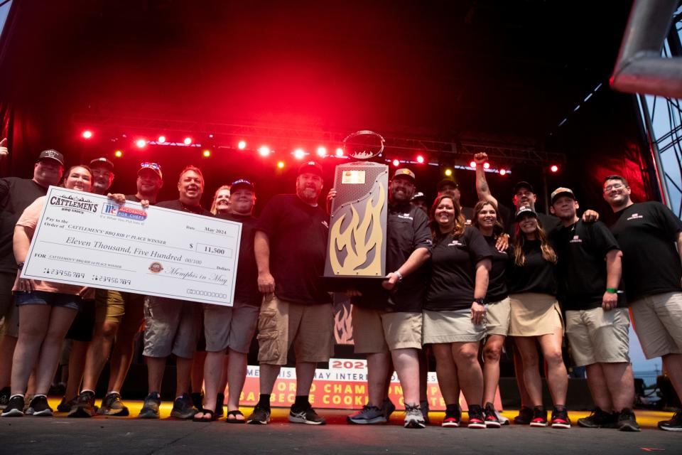 Heath Riles BBQ team members celebrate after they won first in the ribs division at the 2024 World Championship Barbecue Cooking Contest as part of Memphis in May at Liberty Park on Saturday, May 18, 2024.