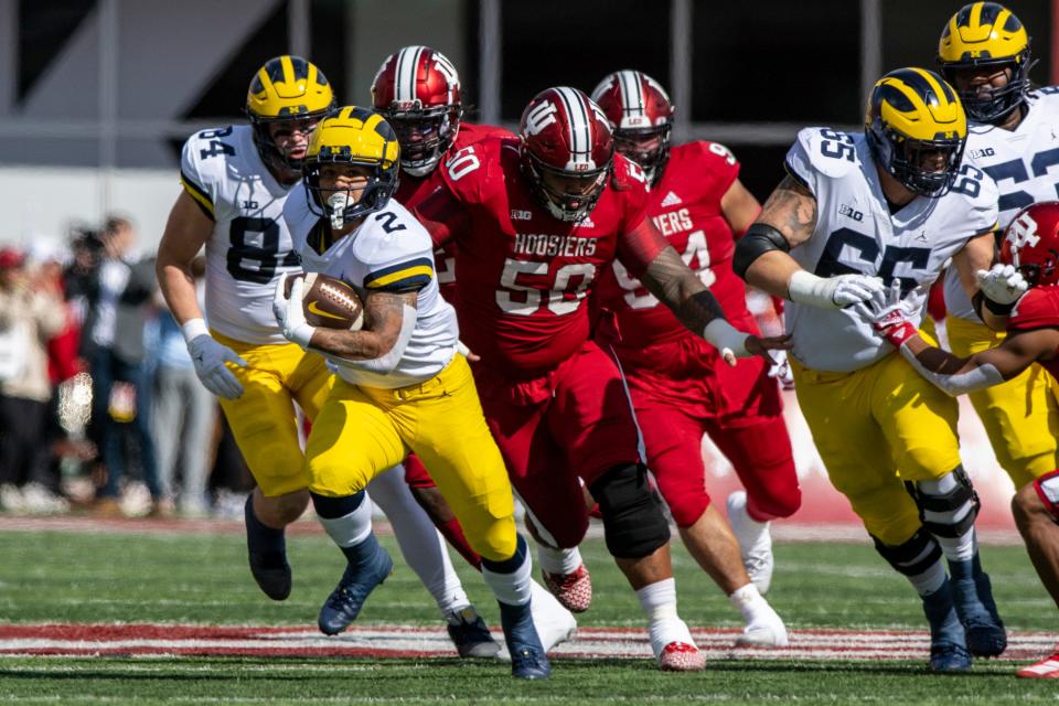 Michigan running back Blake Corum (2) runs the ball out of the backfield during the first half against Indiana, Saturday, Oct. 8, 2022, in Bloomington, Ind.