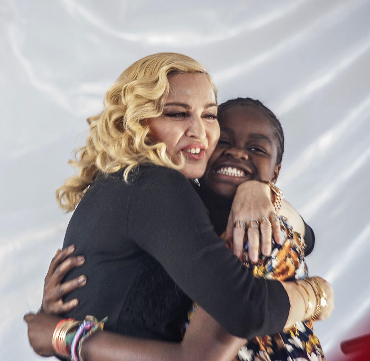 Madonna (L) hugs her Malawian adopted daughter Mercy James after she made a speech during the opening ceremony of the Mercy James Children's Hospital at Queen Elizabeth Central Hospital in Blantyre, Malawi, on July 11, 2017. (Amos Gumulira / AFP via Getty Images)