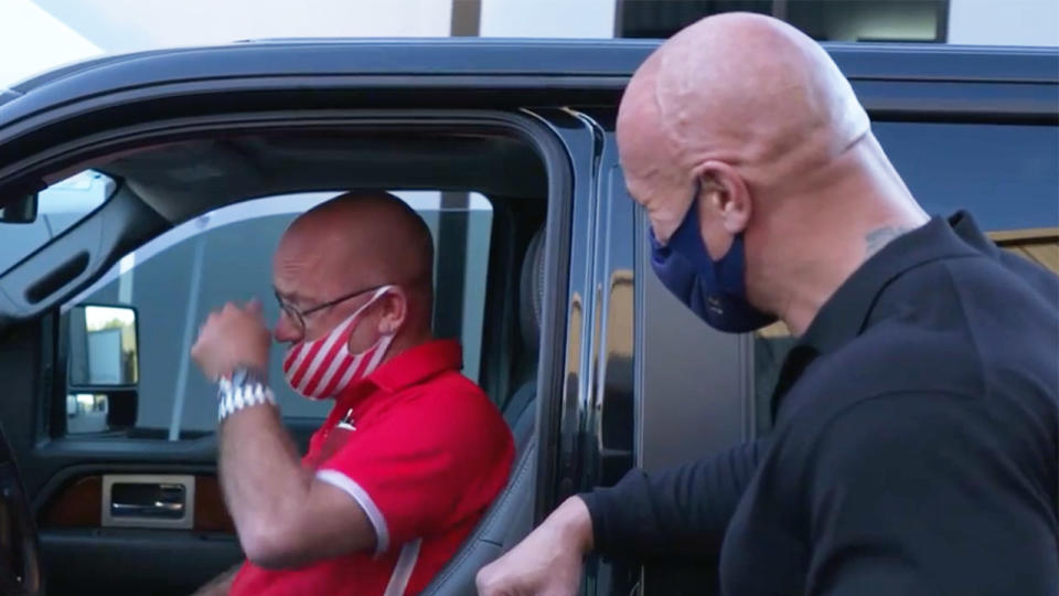 Dwayne, The Rock, Johnson (pictured right) laughing and surprising his friend Bruno Lauer (pictured left) crying with a new car.