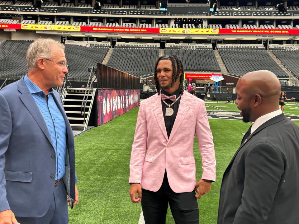 Former Cincinnati Bearcat Deshawn Pace sports the pink jacket at Big 12 media days in Las Vegas Wednesday, July 10 while speaking with new coach Gus Malzahn of UCF. Pace transferred from the Bearcats to the Knights in the offseason.