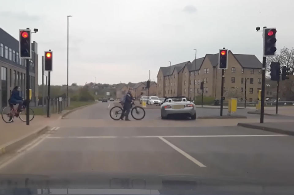 The car sped through the red light, narrowly avoiding a boy on his bike. (Swindon Police)