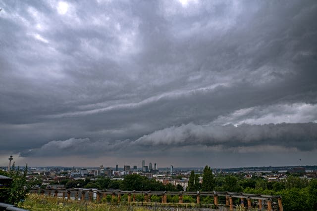 Storm clouds over a green landscape