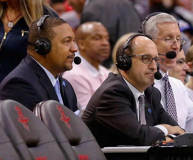 Commentators Marc Jackson, left, and Jeff Van Gundy look on during a basketball game Sunday, April 3, 2016, in Houston. Houston won 118-110. (AP Photo/Bob Levey)