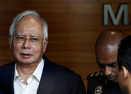 FILE PHOTO: Malaysia's former prime minister Najib Razak arrives to give a statement to the Malaysian Anti-Corruption Commission (MACC) in Putrajaya, Malaysia May 24, 2018. REUTERS/Lai Seng Sin/File Photo