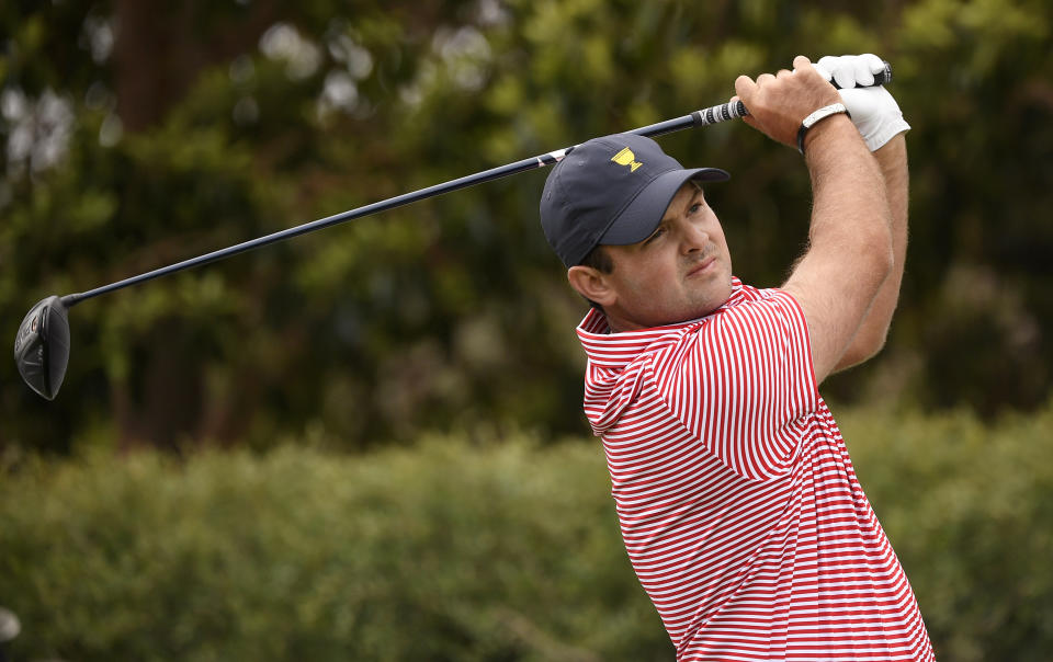 U.S. team player Patrick Reed tees off on the 9th hole during their fourball match at the Royal Melbourne Golf Club in the opening rounds of the President's Cup golf tournament in Melbourne, Thursday, Dec. 12, 2019. (AP Photo/Andy Brownbill)