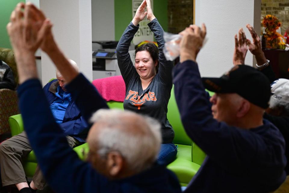 24-year-old Elaina Bautista volunteers at AGE of Central Texas in Austin, Texas on December 2, 2022. Bautista was part of a workforce development program at UT Austin called E4 Texas, an inclusive job training program open to students with developmental disabilities.